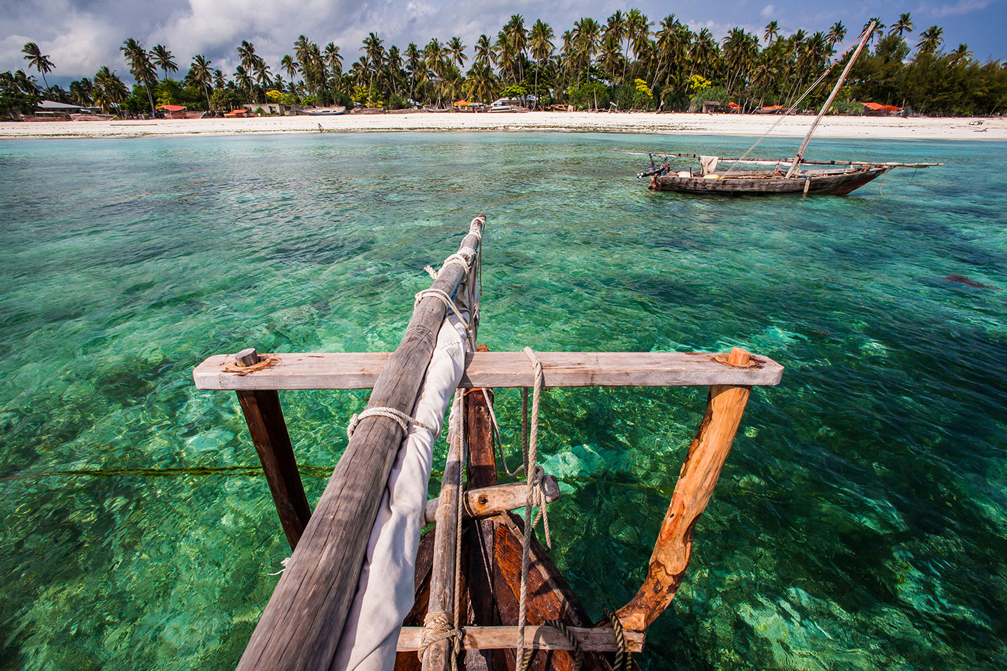 Nungwi, Zanzibar A wooden dhow boat in Zanzibar, Tanzania with pristine and clear waters