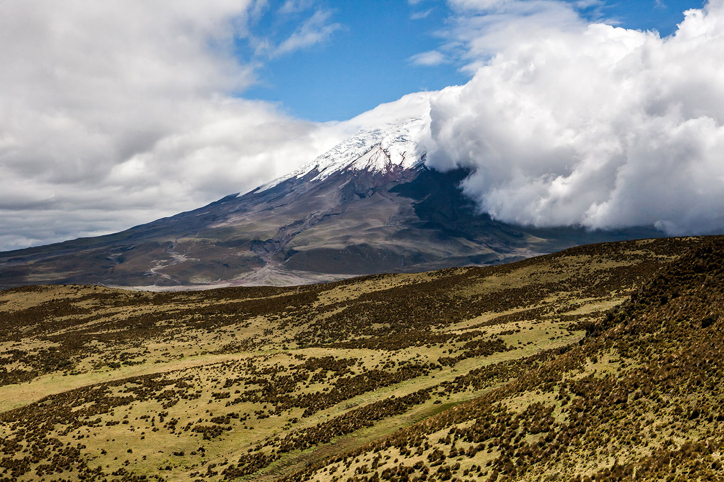 Cotopaxi volcano with clouds covering