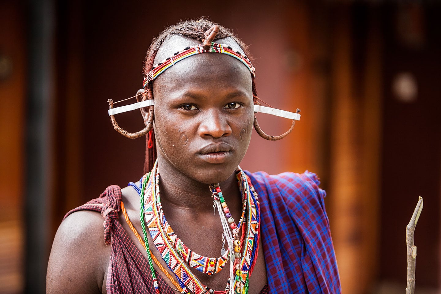 Maasai warrior with a traditional headpiece in Kenya, Africa