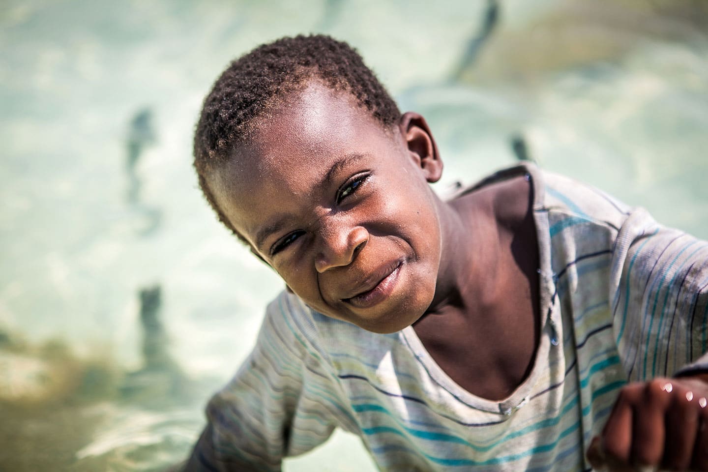 Paje, Zanzibar A young boy on a seaweed farm in Paje, Zanzibar