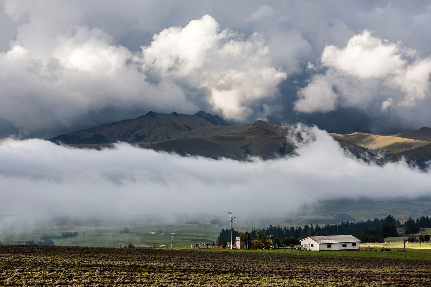 Low hanging clouds around the Cotopaxi volcano in Ecuador