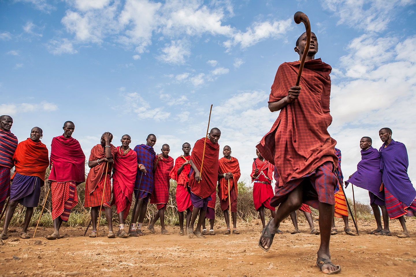 Maasai men doing a traditional dance in their village in Kenya, Africa