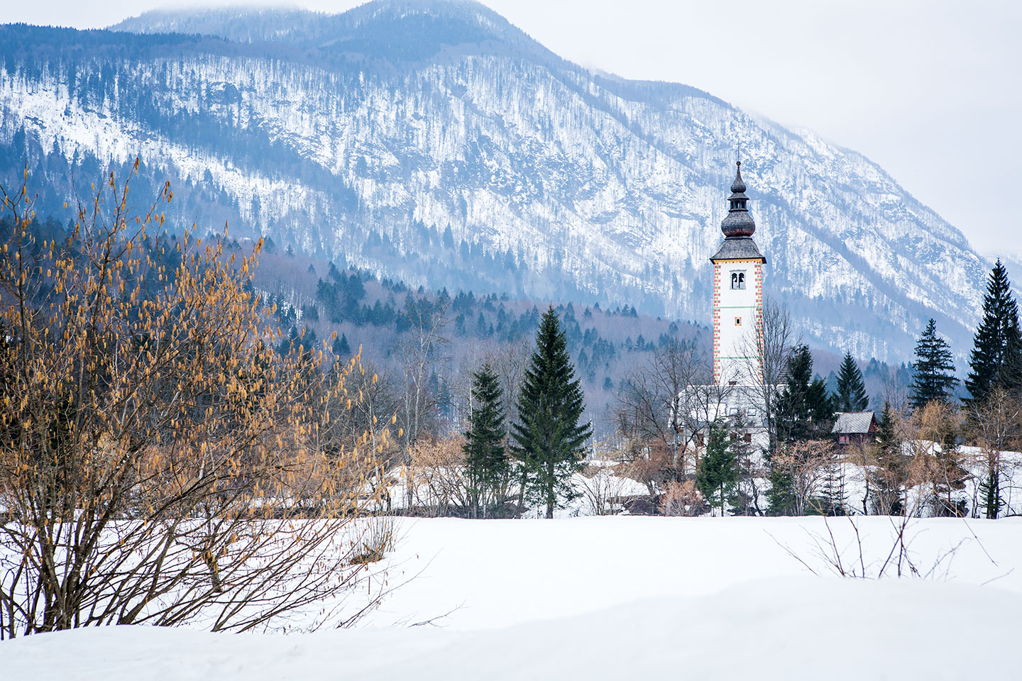 Lake Bohinj, Slovenia Church in the snow around Lake Bohinj, Slovenia