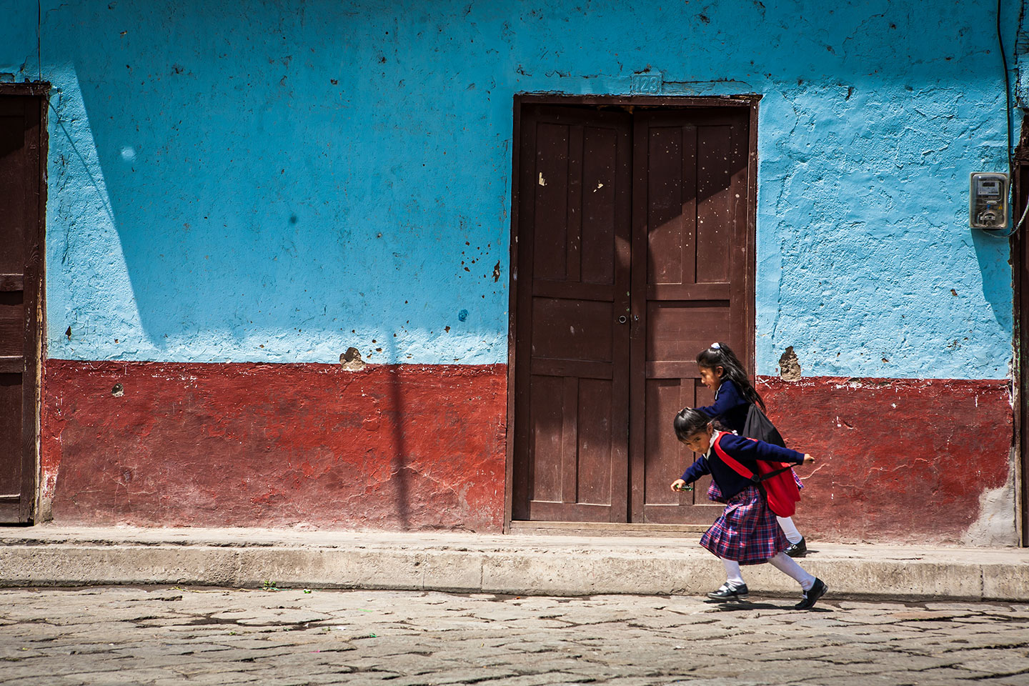 Kids running on the streets of Riobamba, Ecuador