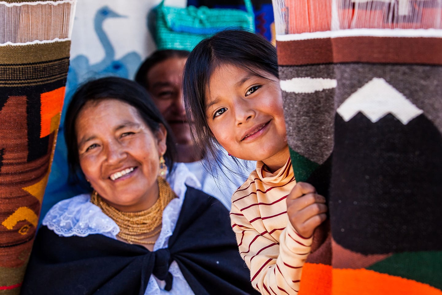 Happy vendors on the market of Otavalo