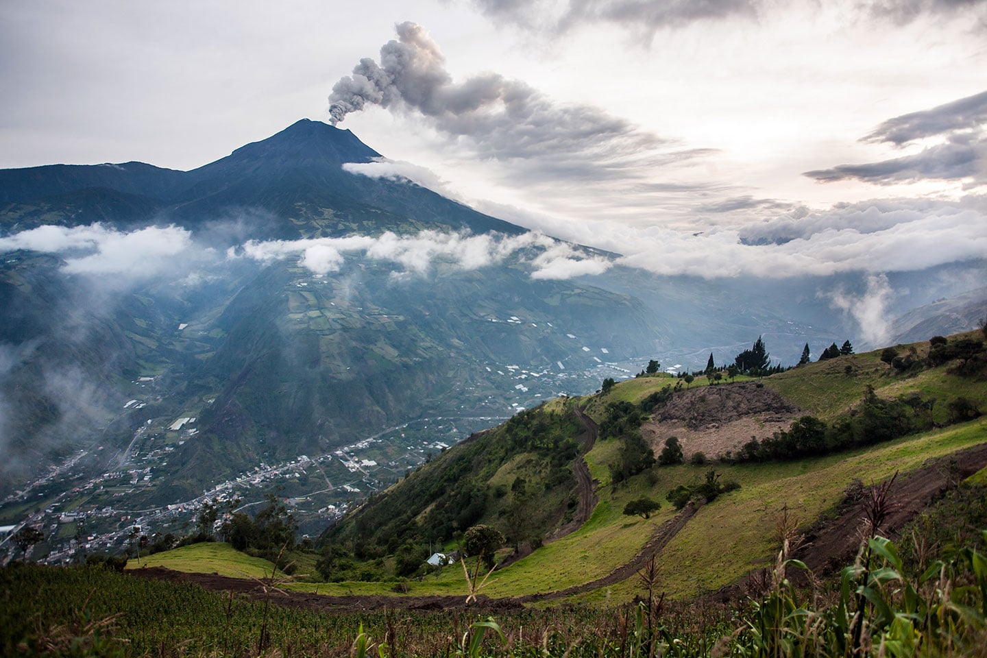 The Tungurahua Volcano spitting out smoke in Baños, Ecuador