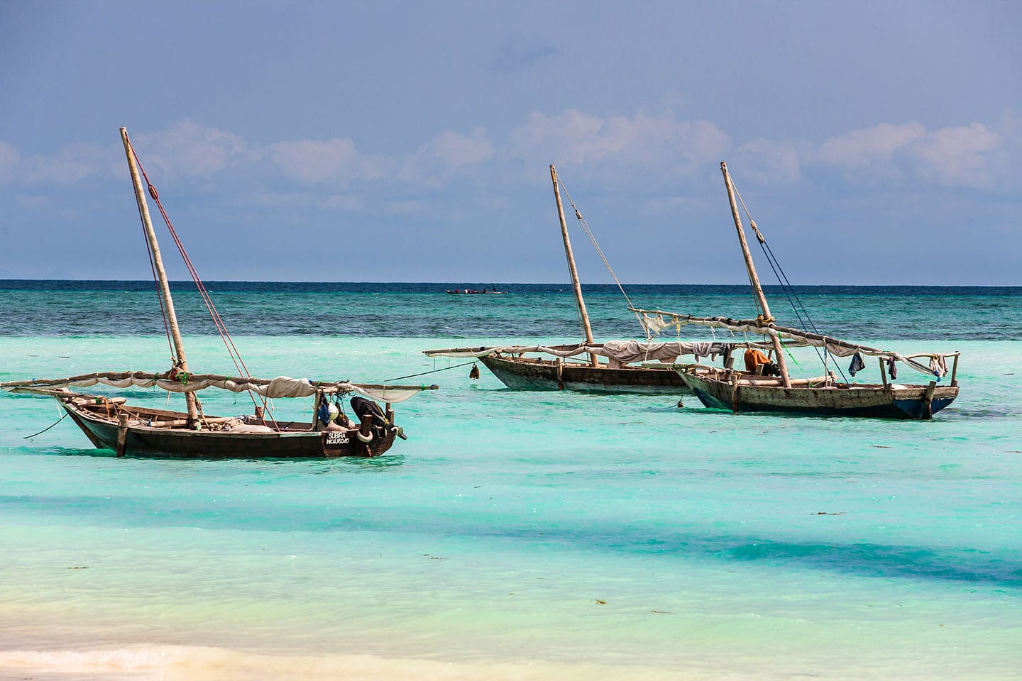 Nungwi, Zanzibar Wooden dhow boats in the clear waters of Zanzibar