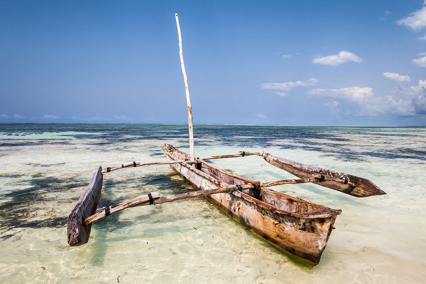Nungwi, Zanzibar Wooden dhow boat on the beach at Nungwi, Zanzibar