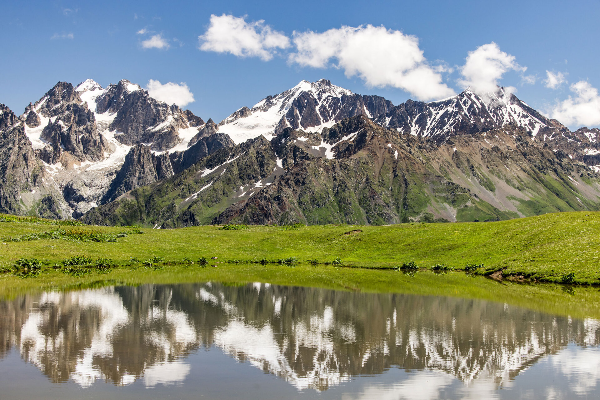 Reflection of the mountains in the Koruldi lake, Georgia
