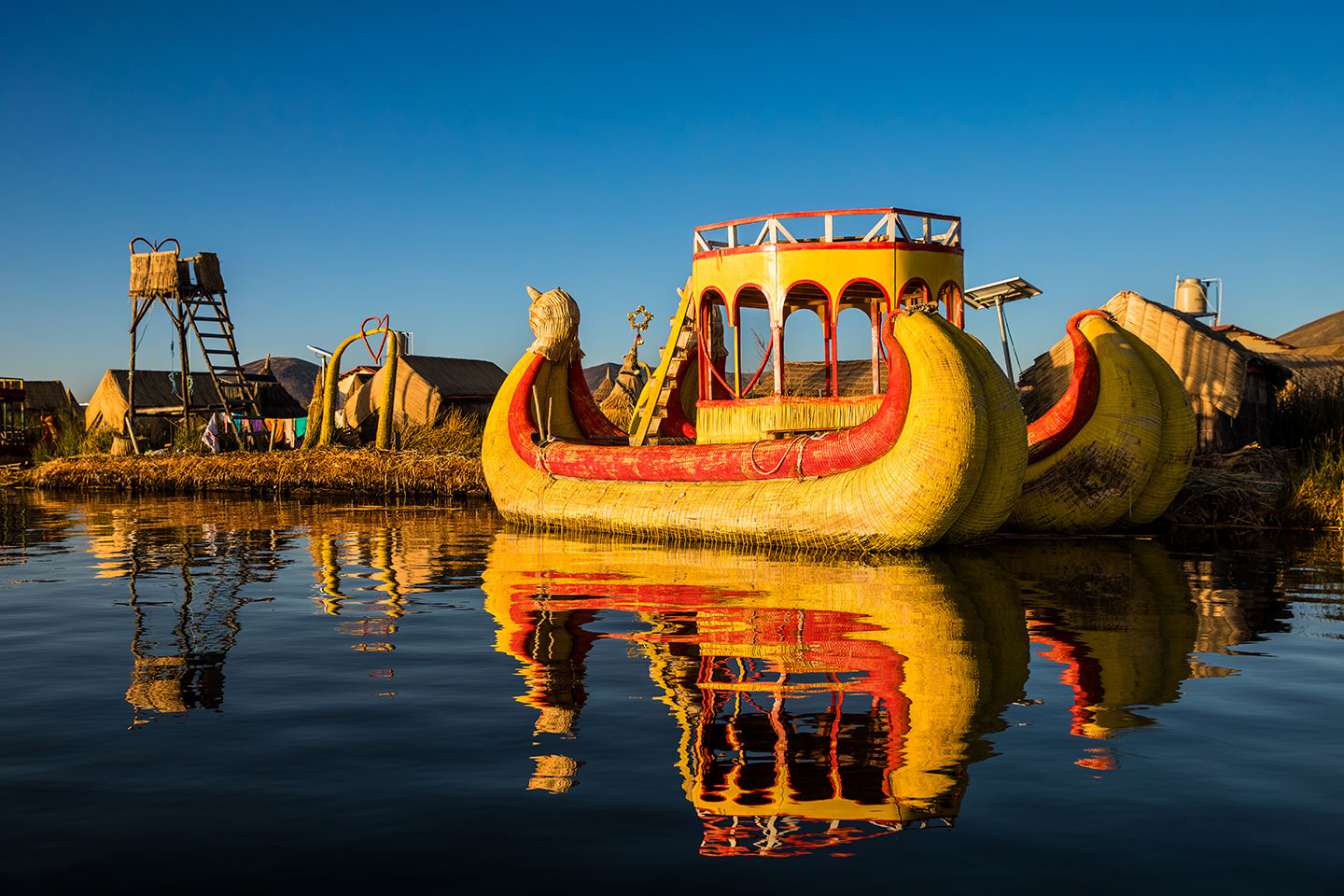 Lake Titicaca, Peru Reed boats at sunrise floating in Lake Titicaca, Peru