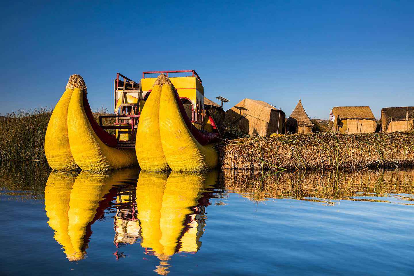 Lake Titicaca, Peru Floating reed boats and an Uros island at Lake Titicaca, Peru
