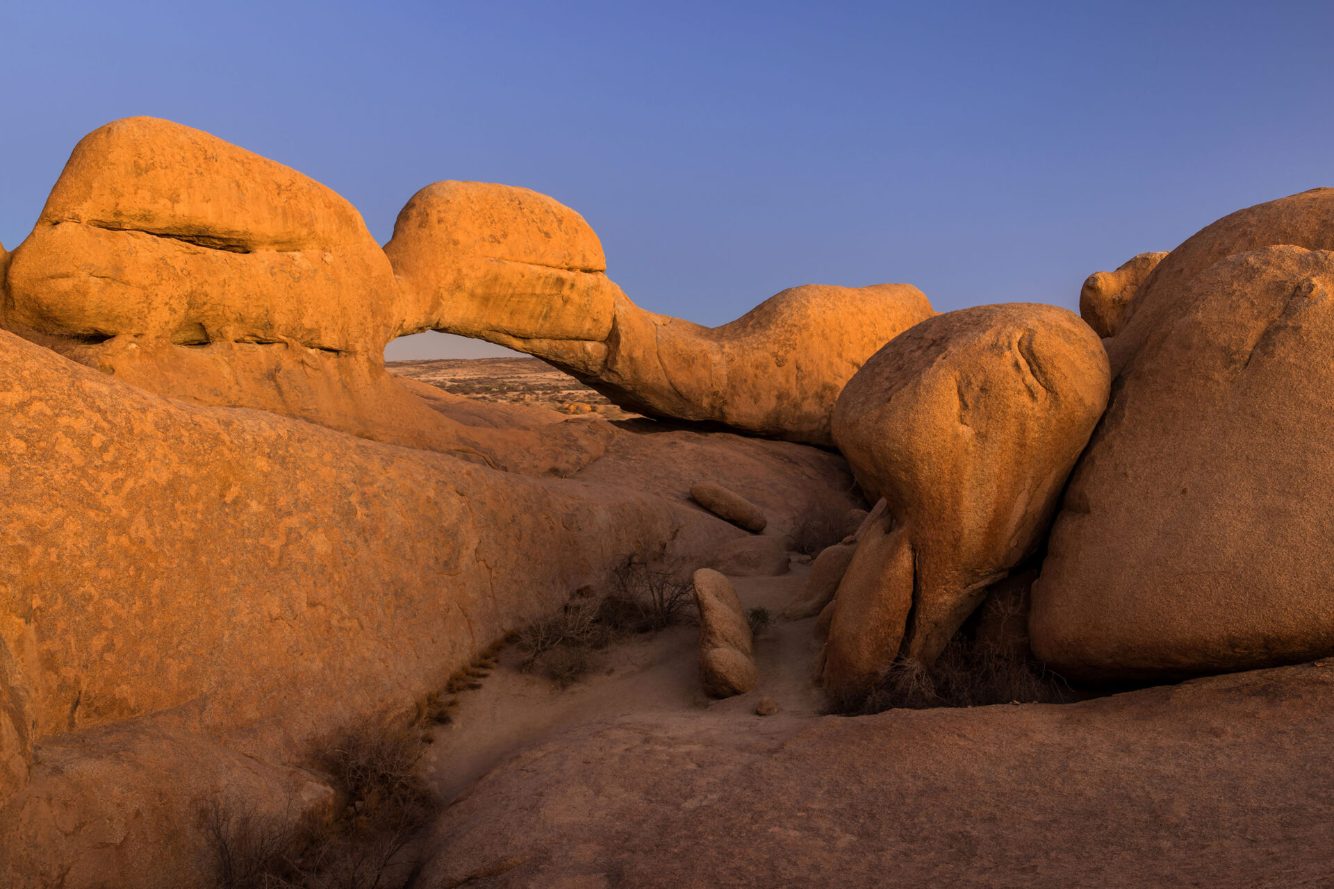 Dusk at the natural rock arch of Spitzkoppe, Namibia