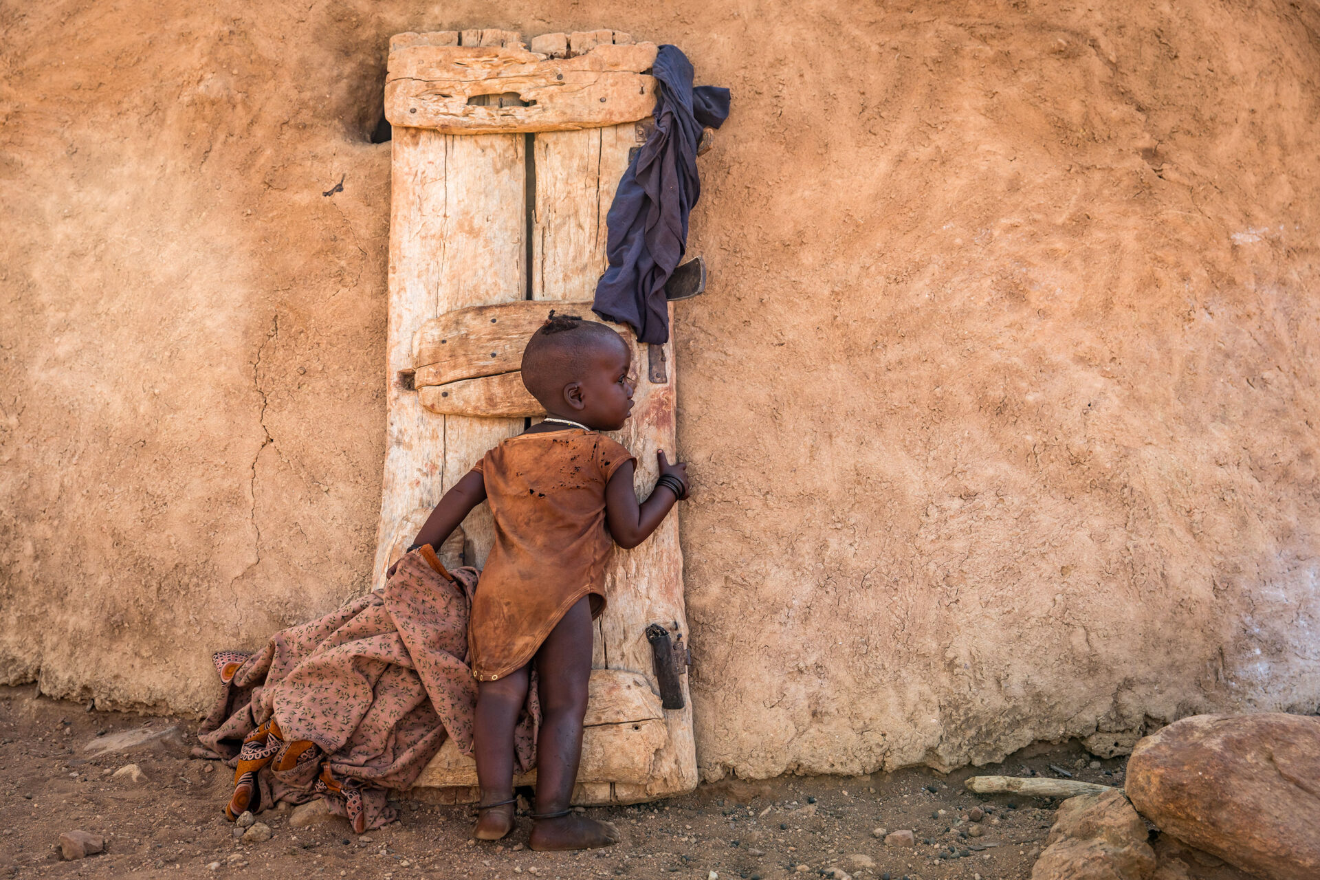 Young child in a Himba village in the north of Namibia