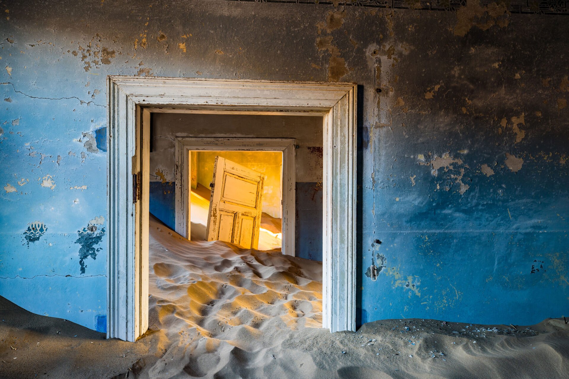Abandoned house filled with sand at Kolmanskop, Namibia