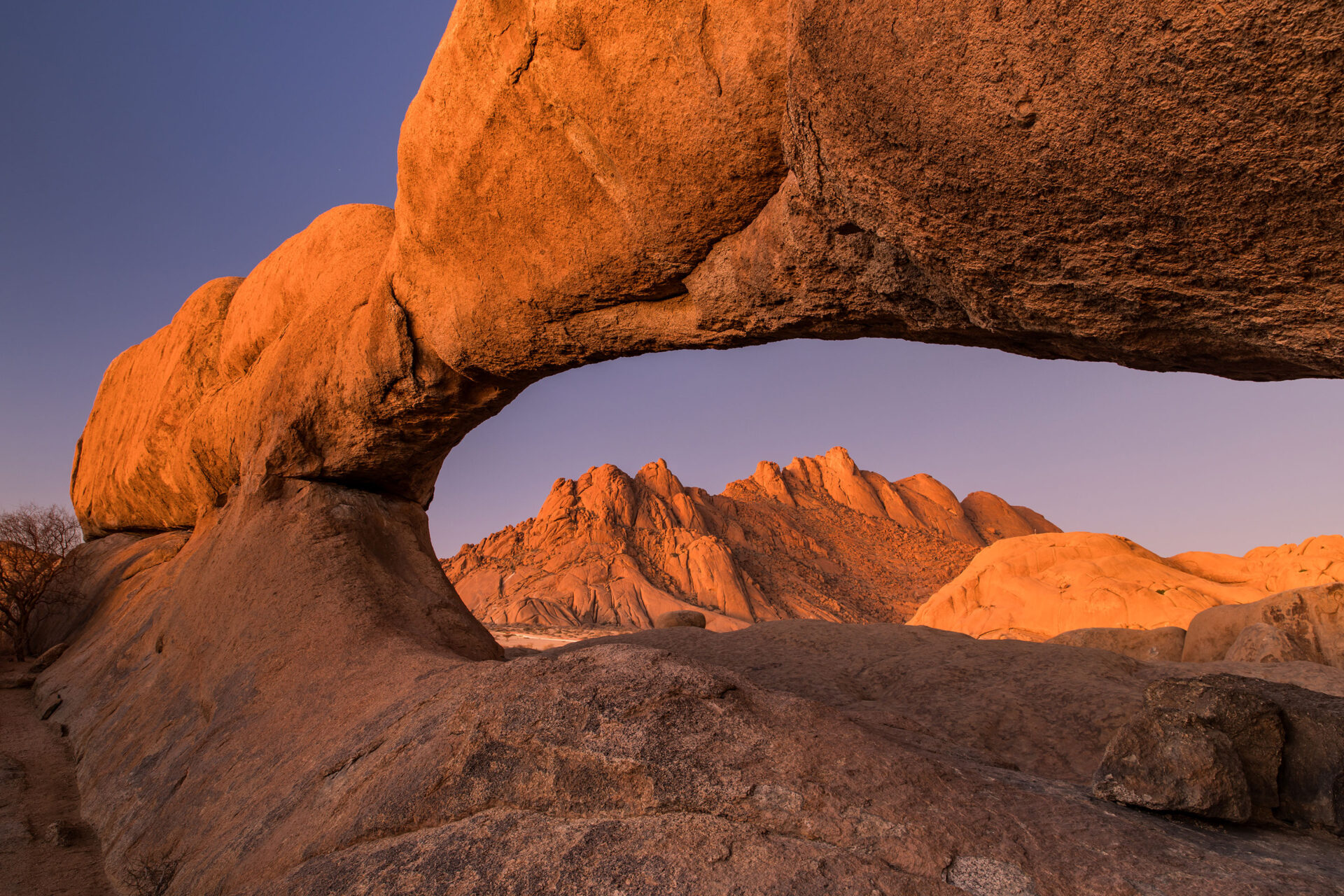 Sunset over the natural rock arch at Spitzkoppe, Namibia