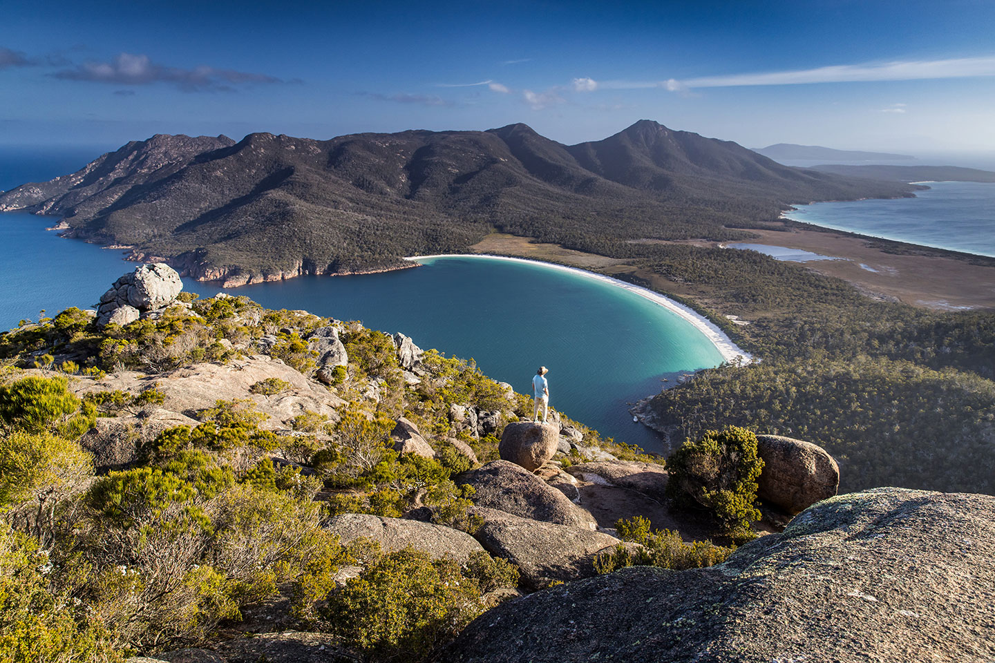 Freycinet National Park, Tasmania Hiker at the top of Mount Amos in Freycinet National Park, Tasmania