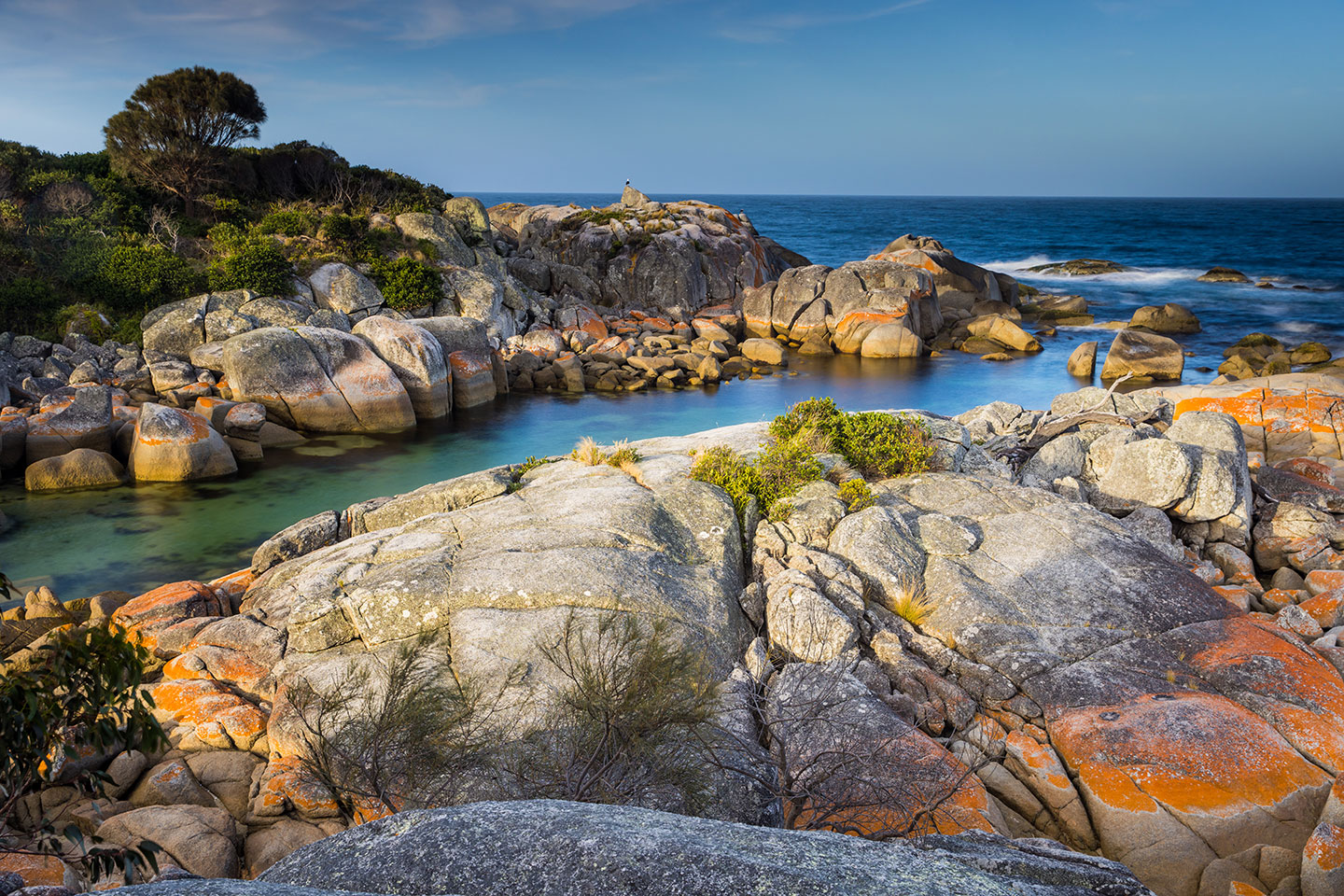Binalong Bay, Tasmania Sunset over the red rocks at Binalong Bay, Tasmania