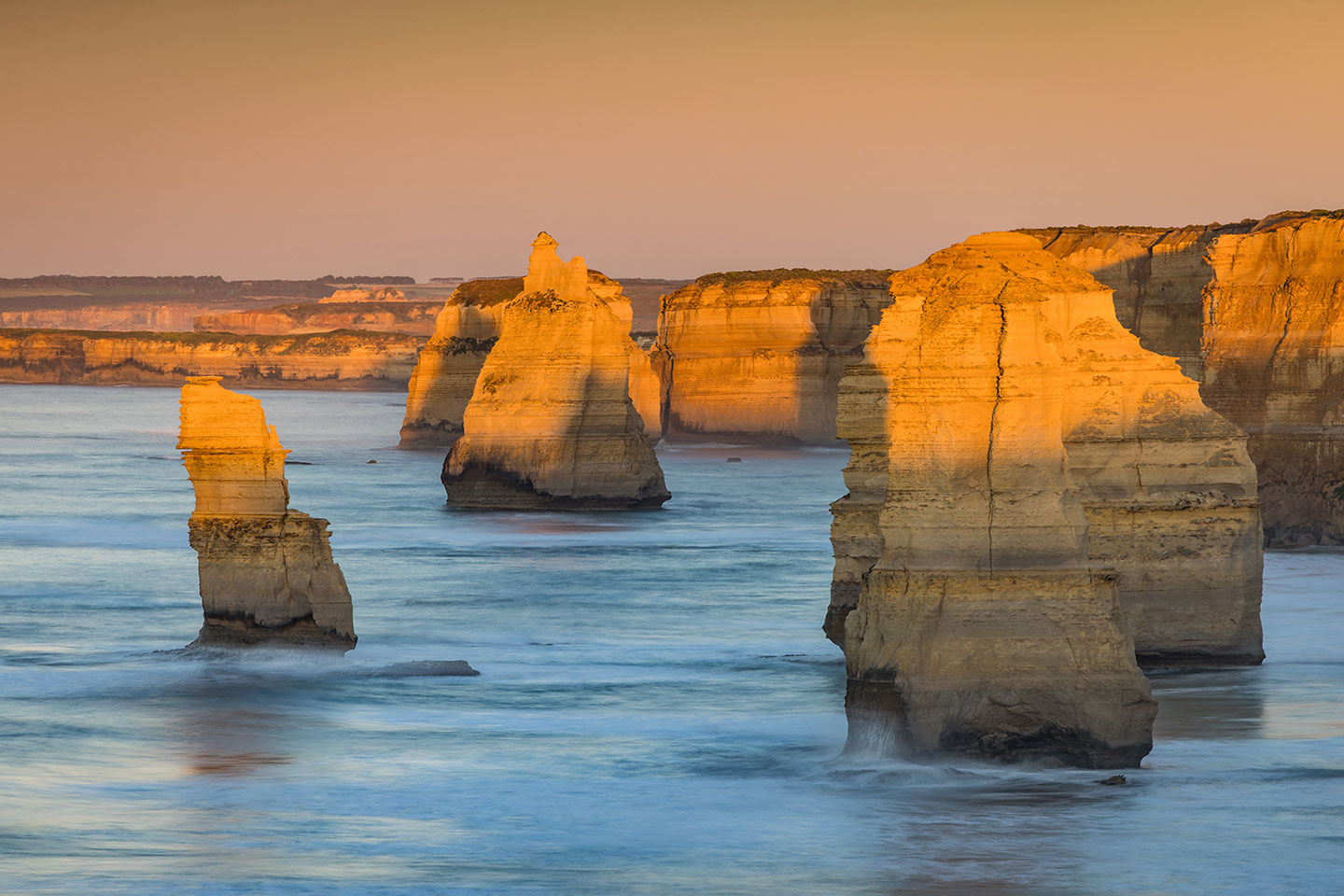 Sunrise over the Twelve apostles with the first light hitting the stacks
