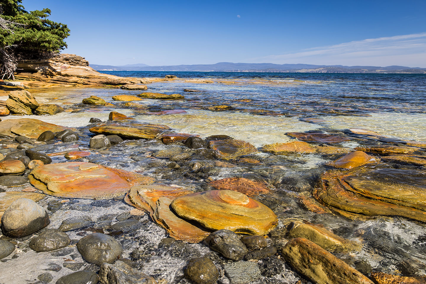 Maria Island, Tasmania Clear waters at the painted cliffs on Maria Island, Tasmania