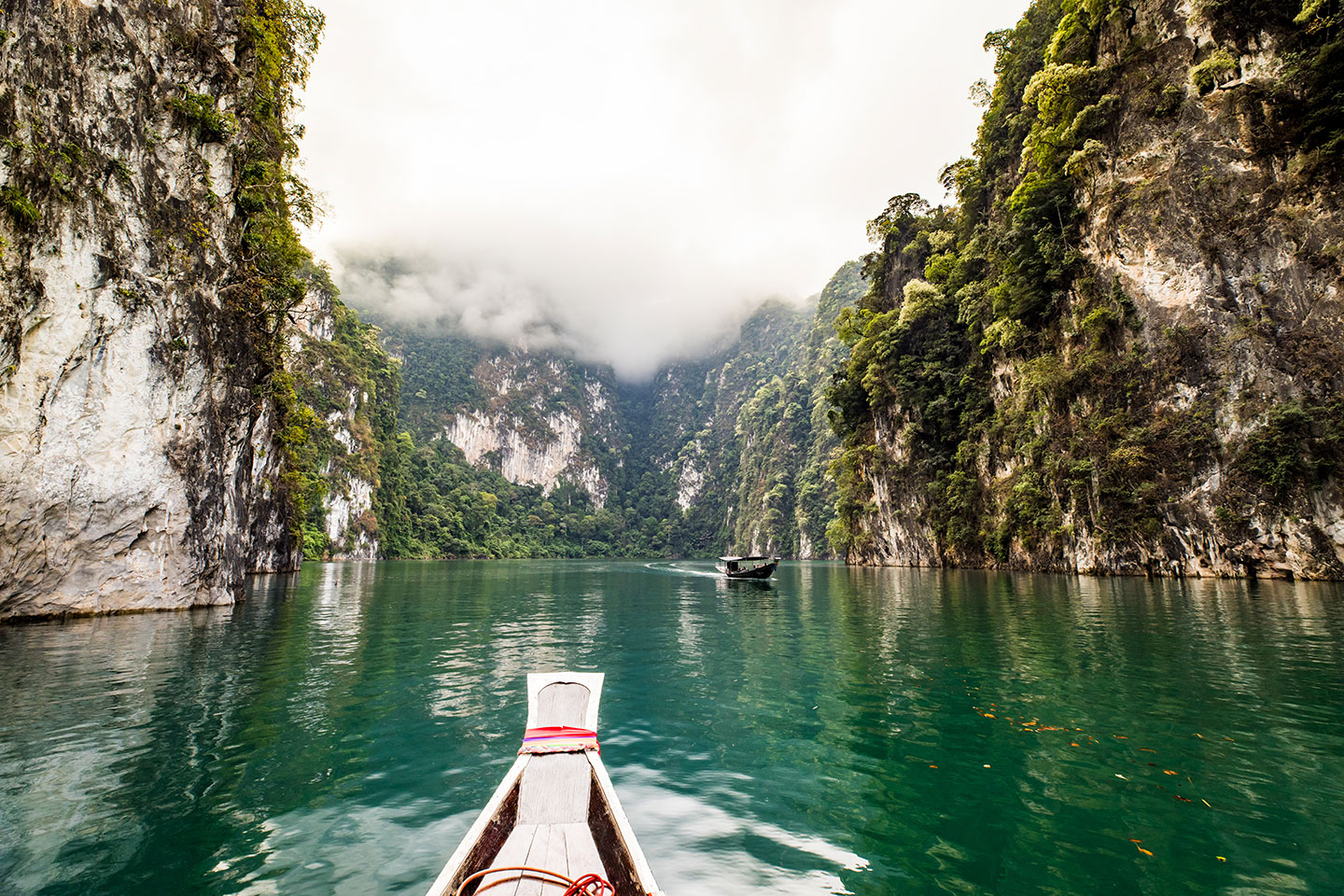 Cheow Lan Lake Wooden long tail boat on Cheow Lan Lake in Khao Sok National Park