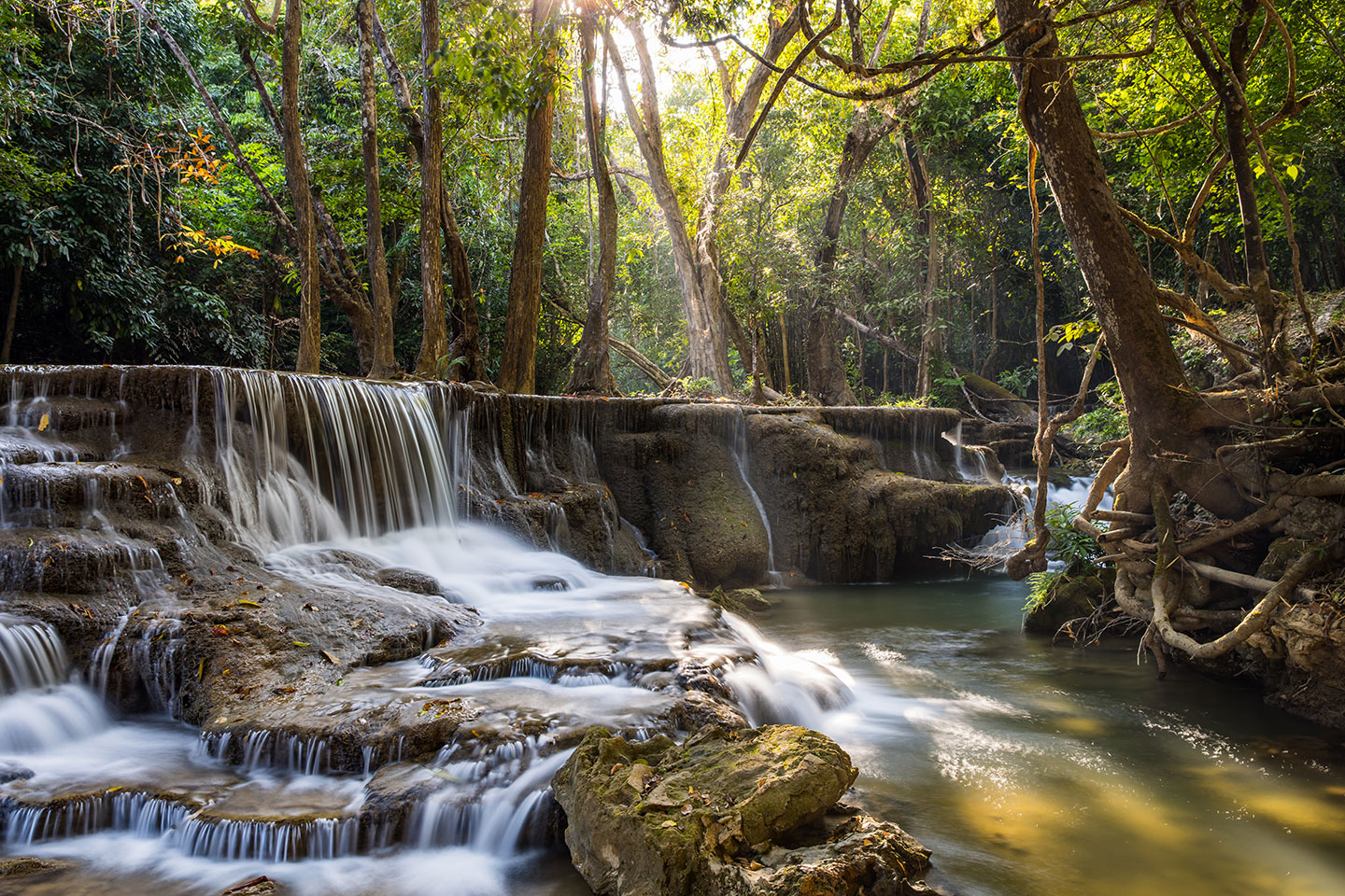 Huay Maekamin Sunlight piercing through the trees at Huay Maekamin waterfalls